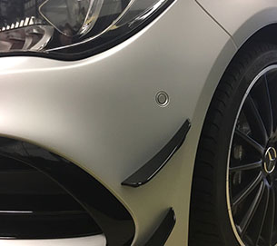 A white coating on a front bumper A white coating on a front bumper